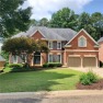 Wonderful brick and frame home positioned between two for sale in Woodstock Georgia Cherokee County County on GolfHomes.com