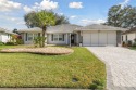 This home comes with upgrades and plenty of charm, drive up to for sale in Leesburg Florida Lake County County on GolfHomes.com