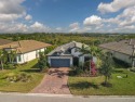 Nestled on a premium preserve lot, this impeccably maintained for sale in Lakewood Ranch Florida Manatee County County on GolfHomes.com