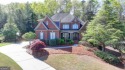 Stunning 5 bed/5.5 bath MASTER-ON-MAIN, 4-side BRICK home with for sale in Suwanee Georgia Gwinnett County County on GolfHomes.com