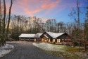 Situated on 5.135 private acres, this custom-built Riverbend for sale in Central City Pennsylvania Somerset County County on GolfHomes.com