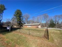 Tons of potential in this brick ranch home overlooking the 18th for sale in State Road North Carolina Surry County County on GolfHomes.com
