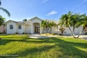 This exquisite waterfront home w/ gas heated; saltwater pool for sale in Merritt Island Florida Brevard County County on GolfHomes.com