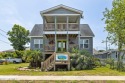 Water view of Calico Bay!  This 6 bed 1 1/2 bath has been fully for sale in Morehead City North Carolina Carteret County County on GolfHomes.com