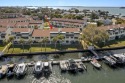 Looking for affordable waterfront living with a deeded boat slip for sale in Dunedin Florida Pinellas County County on GolfHomes.com