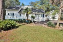 Tucked beneath the canopy of Southport's iconic old-growth oak for sale in Southport North Carolina Brunswick County County on GolfHomes.com