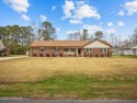 Carolina country charm at its finest! This gorgeous brick ranch for sale in Jacksonville North Carolina Onslow County County on GolfHomes.com