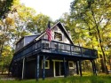 Country charm! Welcome to your meticulously maintained chalet for sale in Lords Valley Pennsylvania Pike County County on GolfHomes.com