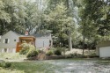 Welcome to your dream woodland cottage tucked away on 1.5 serene for sale in Richmond Indiana Wayne County County on GolfHomes.com
