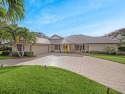 Step into luxury with this stunning 3-bedroom, 3-bath pool home for sale in Stuart Florida Martin County County on GolfHomes.com