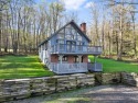 Escape to your cozy retreat in the serene woods of the for sale in Central City Pennsylvania Somerset County County on GolfHomes.com