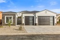 Discover modern desert living at its finest in this brand-new for sale in Fort Mohave Arizona Mohave County County on GolfHomes.com
