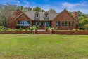 Welcome to your dream retreat nestled behind beautiful gated for sale in Jacksonville Arkansas Pulaski County County on GolfHomes.com