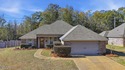 This thoughtfully designed home features quality construction for sale in Pearl Mississippi Rankin County County on GolfHomes.com