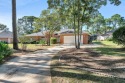 Beautiful, large ranch brick home on a peaceful .57 acre golf for sale in Niceville Florida Okaloosa County County on GolfHomes.com