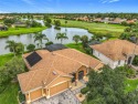 ABSOLUTELY STUNNING Operetta model with a SALT WATER POOL on a for sale in Poinciana Florida Osceola County County on GolfHomes.com