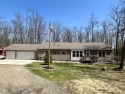 Privacy and seclusion await at this true Up North retreat! This for sale in Roscommon Michigan Crawford County County on GolfHomes.com
