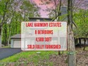 8-Bedroom Showstopper in LAKE HARMONY ESTATES w/ $250,000+ in for sale in Lake Harmony Pennsylvania Carbon County County on GolfHomes.com