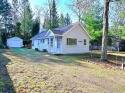 Step into rustic charm with this almost all-knotty pine interior for sale in Saint Helen Michigan Roscommon County County on GolfHomes.com