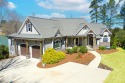 Experience the pinnacle of lakefront luxury in this stunning for sale in Ninety Six South Carolina Greenwood County County on GolfHomes.com