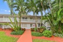 Discover exceptional lakeside living in this rare, rentable for sale in Deerfield Beach Florida Broward County County on GolfHomes.com