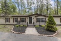 Welcome to this beautifully updated 4-bedroom, 2-bath ranch home for sale in Indian River Michigan Cheboygan County County on GolfHomes.com