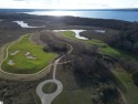 Introducing this stunning, oversized, buildable lot in gated for sale in Williamsburg Michigan Grand Traverse County County on GolfHomes.com