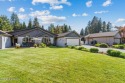 Stunning single level home perfectly nestled with a fantastic for sale in Rathdrum Idaho Kootenai County County on GolfHomes.com
