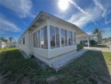 The meticulously maintained two-bedroom, two-bathroom residence for sale in Largo Florida Pinellas County County on GolfHomes.com