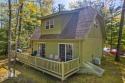 Tucked along the fairways of Garland's Fountains Course, 829 for sale in Lewiston Michigan Oscoda County County on GolfHomes.com