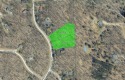Escape to the beauty of Michaywe with this 1.87-acre wooded for sale in Gaylord Michigan Otsego County County on GolfHomes.com
