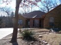 Well maintained home nestled in the trees of Tanglewood Resort for sale in Pottsboro Texas Grayson County County on GolfHomes.com