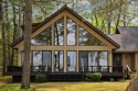 STUNNING WATERFRONT LAKE HOME! This remarkable lakefront for sale in Lewiston Michigan Oscoda County County on GolfHomes.com