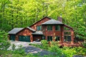 Higgins Lake Private Lake Access home -Discover the perfect for sale in Roscommon Michigan Roscommon County County on GolfHomes.com