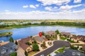 This custom ranch home on a stunning waterfront lot offers an for sale in Windsor Colorado Weld County County on GolfHomes.com