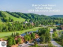 Beautifully remodeled in contemporary mountain side perfection for sale in Mancelona Michigan Antrim County County on GolfHomes.com