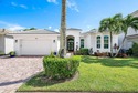 Discover luxury living at 326 Charroux Drive in prestigious for sale in Palm Beach Gardens Florida Palm Beach County County on GolfHomes.com