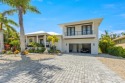 This new construction is a dream come true for boaters and water for sale in Holmes Beach Florida Manatee County County on GolfHomes.com