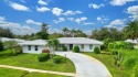 Panoramic golf and lake views abound at this Sandpiper Bay gem! for sale in Port Saint Lucie Florida Saint Lucie County County on GolfHomes.com