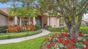 Situated on almost A HALF ACRE, spacious and expertly appointed for sale in Parrish Florida Manatee County County on GolfHomes.com