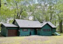 Rustic mountain escape with warm wood features! This 3 bedroom for sale in Lake Harmony Pennsylvania Carbon County County on GolfHomes.com