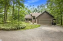 Enjoy a peaceful, wooded retreat. This charming property offers for sale in Gaylord Michigan Otsego County County on GolfHomes.com