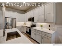 The Barrington 2 by Landmark Homes offers lock & leave for sale in Longmont Colorado Weld County County on GolfHomes.com