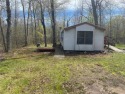 2 lots, nice location! 2 bedroom, 1 bath mobile home selling *AS for sale in Garrison Minnesota Mille Lacs County County on GolfHomes.com