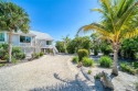 Experience Island living in this stunning elevated duplex for sale in Sanibel Florida Lee County County on GolfHomes.com