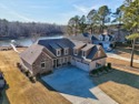 Live the lake-and-golf lifestyle at Grand Harbor, where custom for sale in Ninety Six South Carolina Greenwood County County on GolfHomes.com