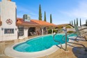 This spacious Southwest-style custom pool home is perfect for for sale in Kingman Arizona Mohave County County on GolfHomes.com