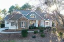 This truly custom residence is rich in architectural detail for sale in Ninety Six South Carolina Greenwood County County on GolfHomes.com