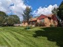 Prestigeous WOODCROFT ESTATES updated 3-bedroom, 2.5-bath Brick for sale in Flint Michigan Genesee County County on GolfHomes.com