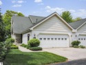 Bass Lake front Quality Condo with sunset views. Tile, Granite for sale in Elk Rapids Michigan Antrim County County on GolfHomes.com